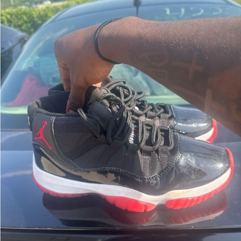Jordan Bred 11s | Black and Red High-Top Sneakers - Picture 4 of 4